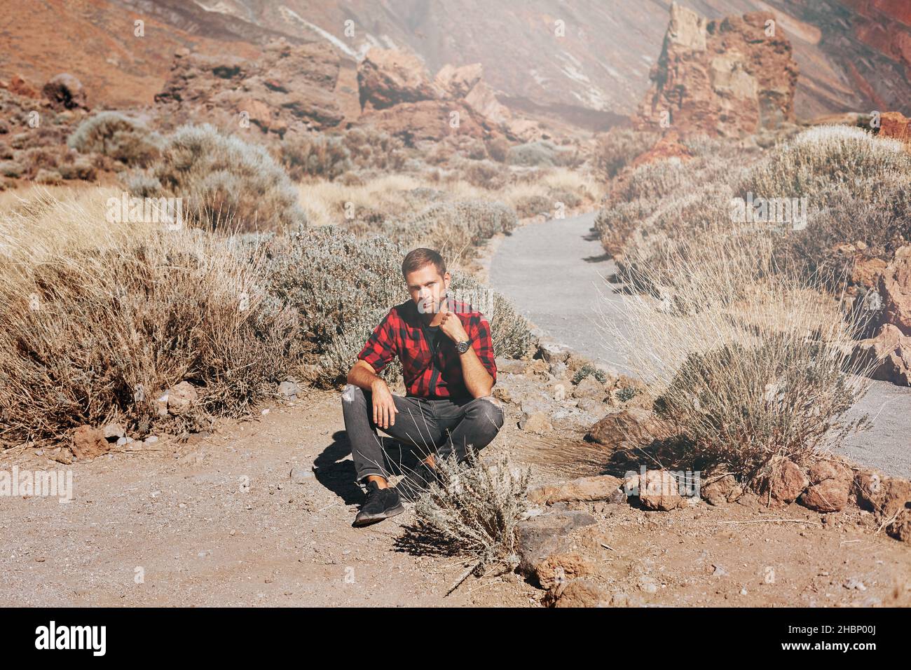 Young man in mountains or canyon Stock Photo