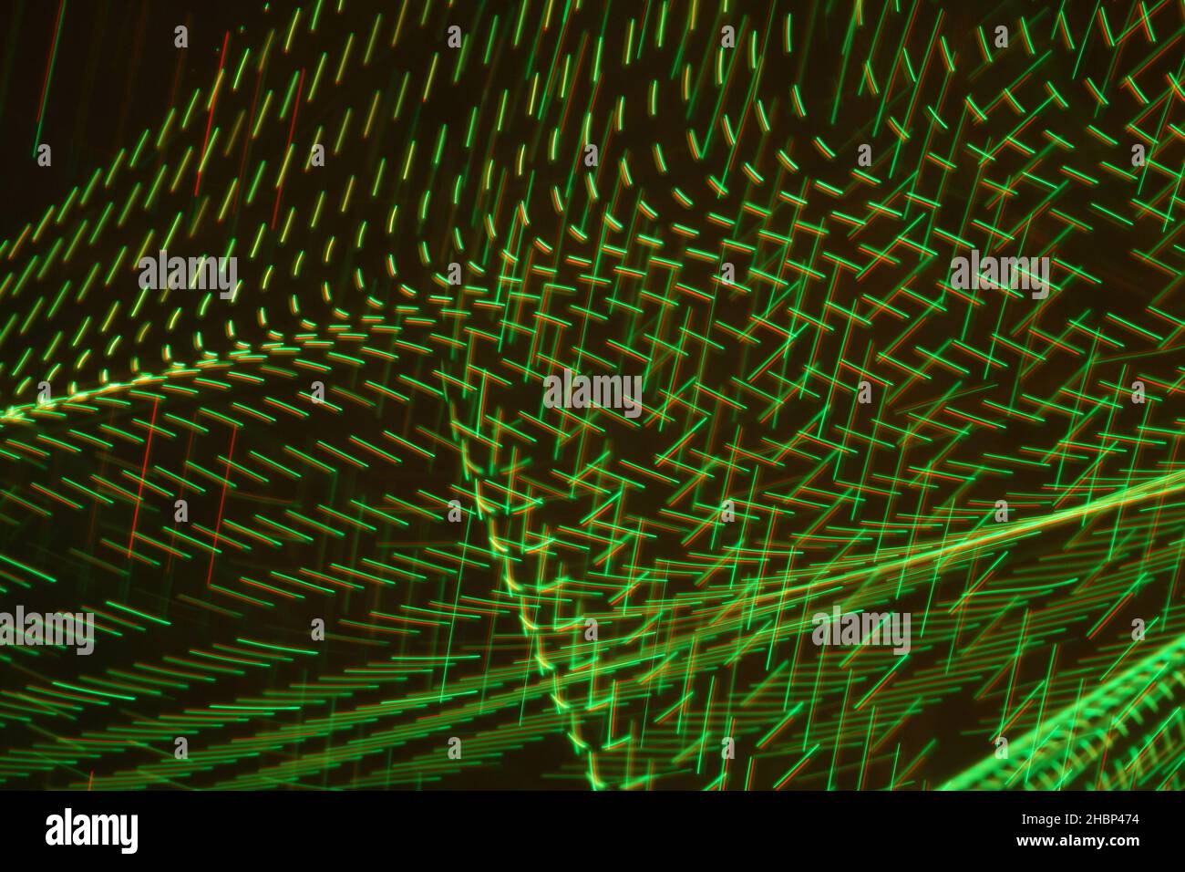 An abstract moving green neon light for techno wallpaper or background ...