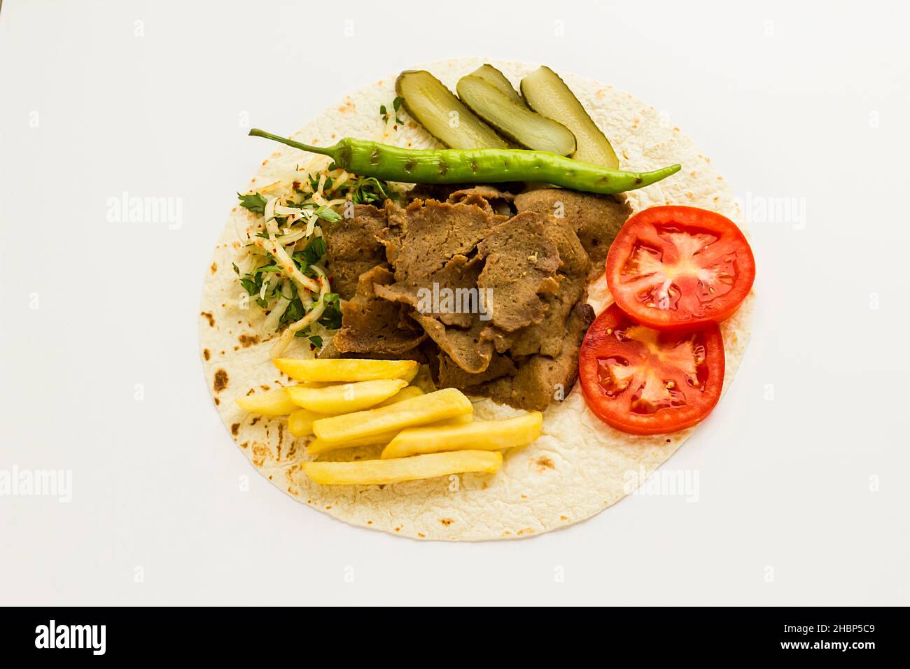 Traditional Turkish kebab doner with sliced tomatoes,grilled vegetables on lavas bread Stock Photo