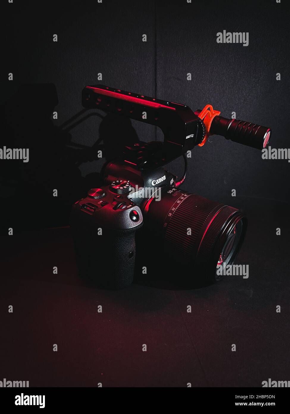 FORT LAUDERDALE, UNITED STATES - Nov 12, 2021: A vertical shot of Canon EOS  R6 camera in a dark studio with red light on it Stock Photo - Alamy