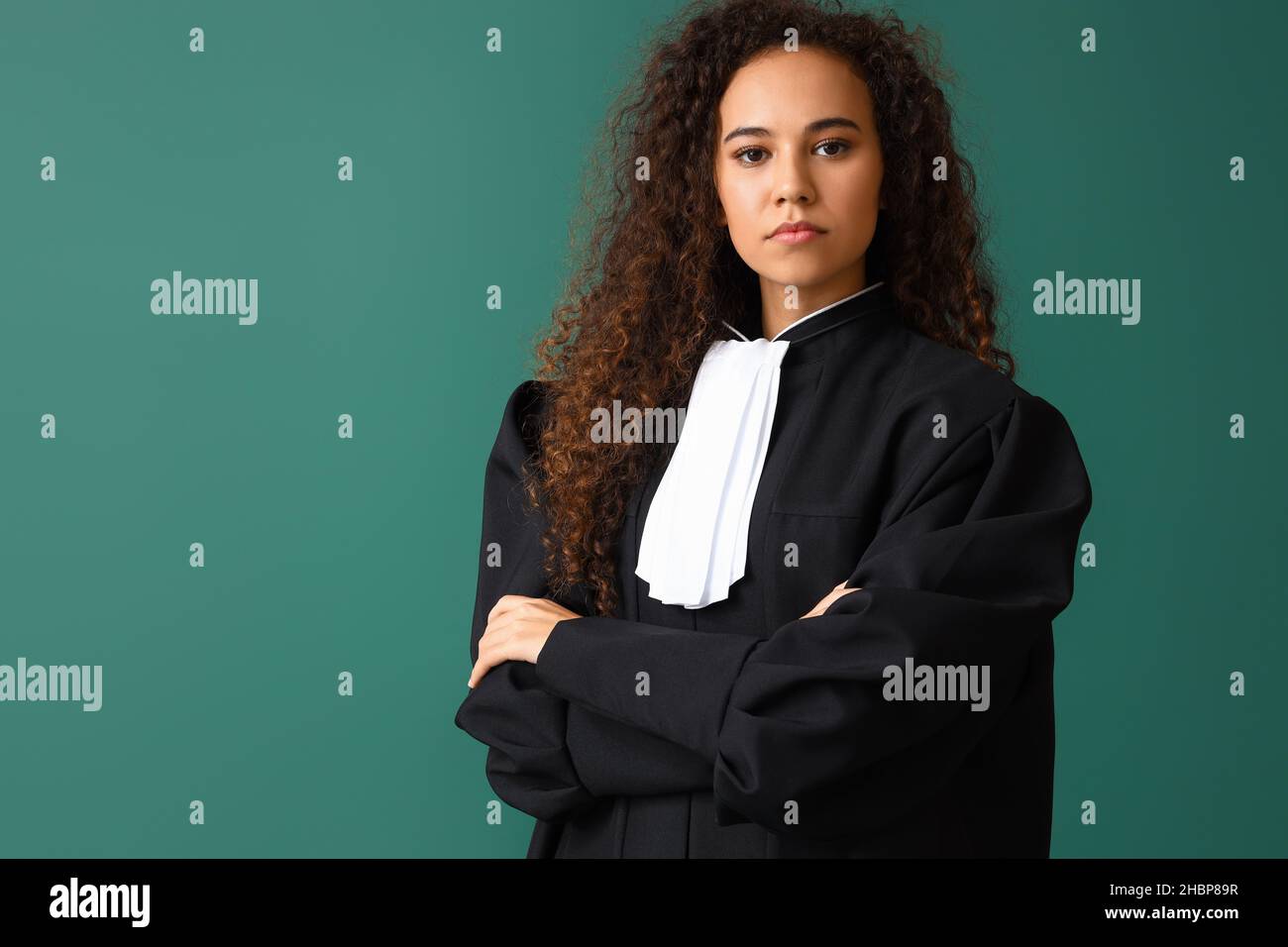 Portrait of female judge on color background Stock Photo - Alamy