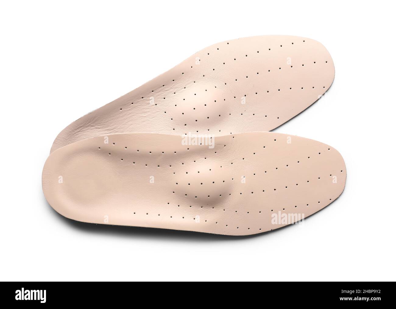 Beige orthopedic insoles on white background Stock Photo - Alamy