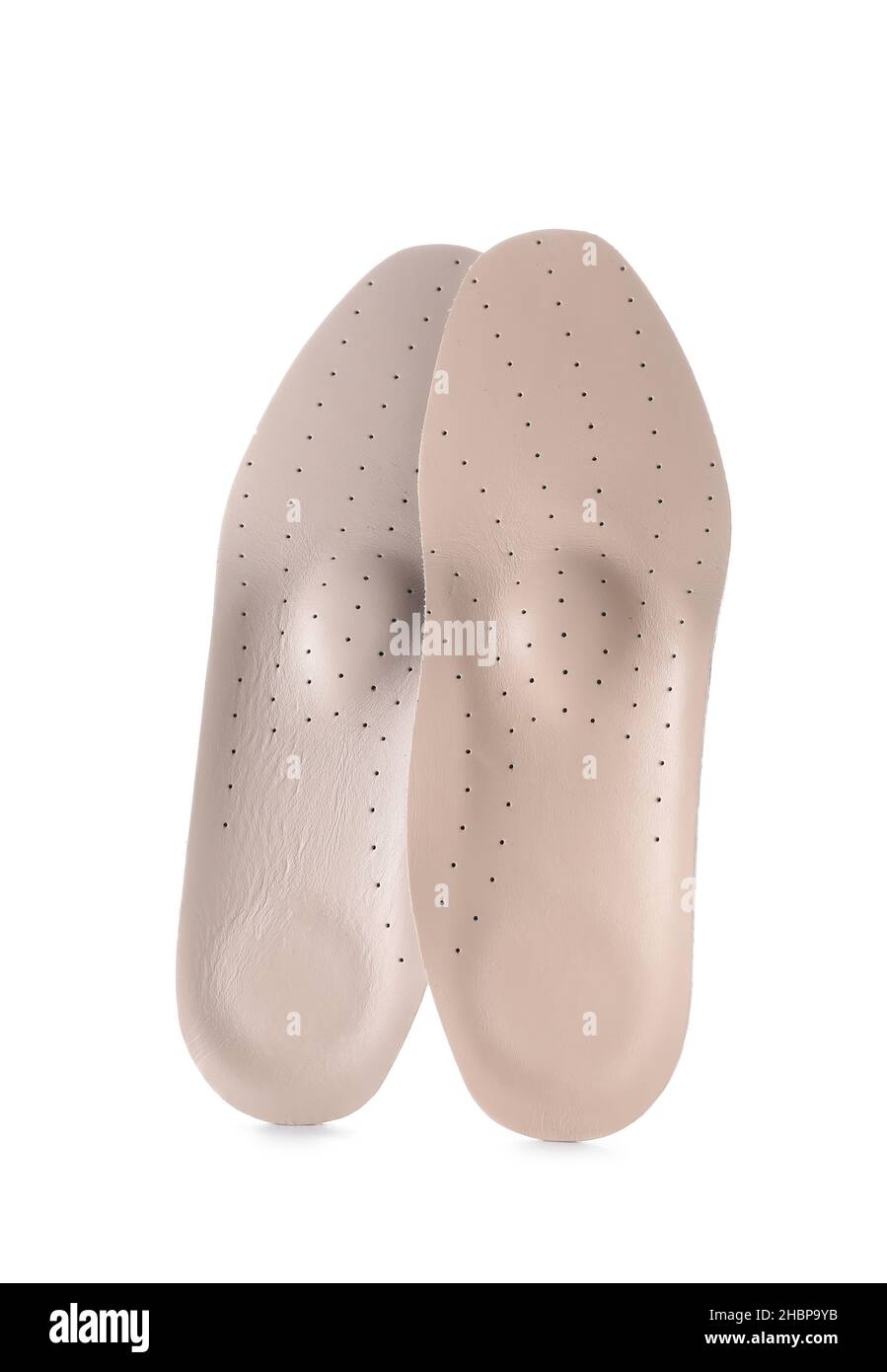 Beige orthopedic insoles on white background Stock Photo - Alamy