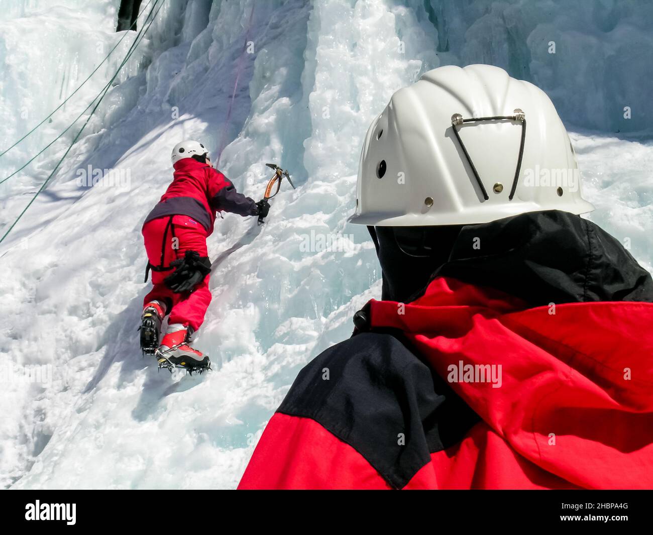 Man climbing steep ice hi-res stock photography and images - Alamy