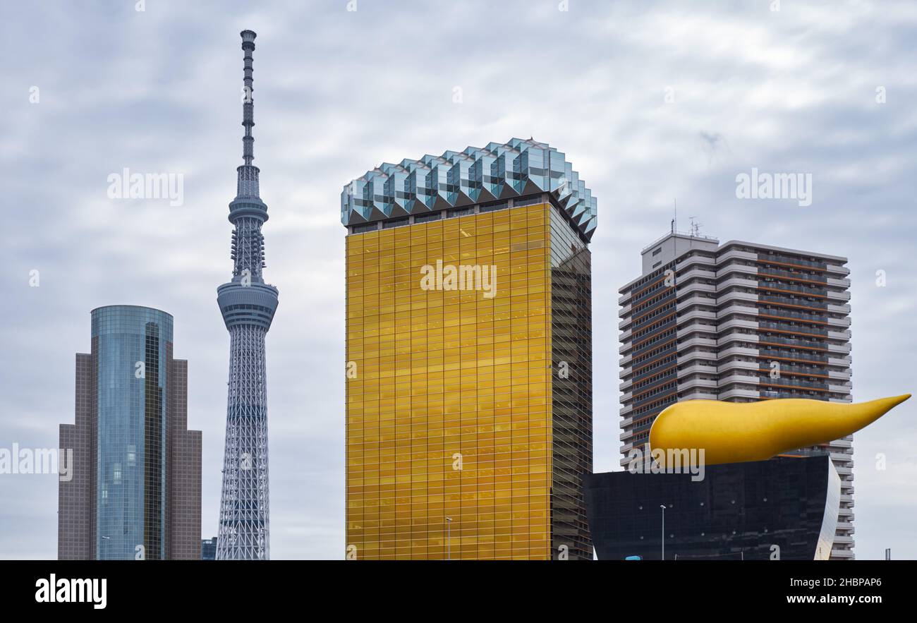 Tokyo, Japan - October 24, 2019 The most recognizable modern structures of Tokyo, Asahi Beer Hall, Asahi Flame, Sumida ward office and Tokyo Skytree, Stock Photo