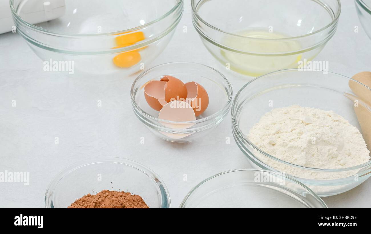 Making chocolate cake. Step by step recipe, ingredients close up on kitchen table Stock Photo