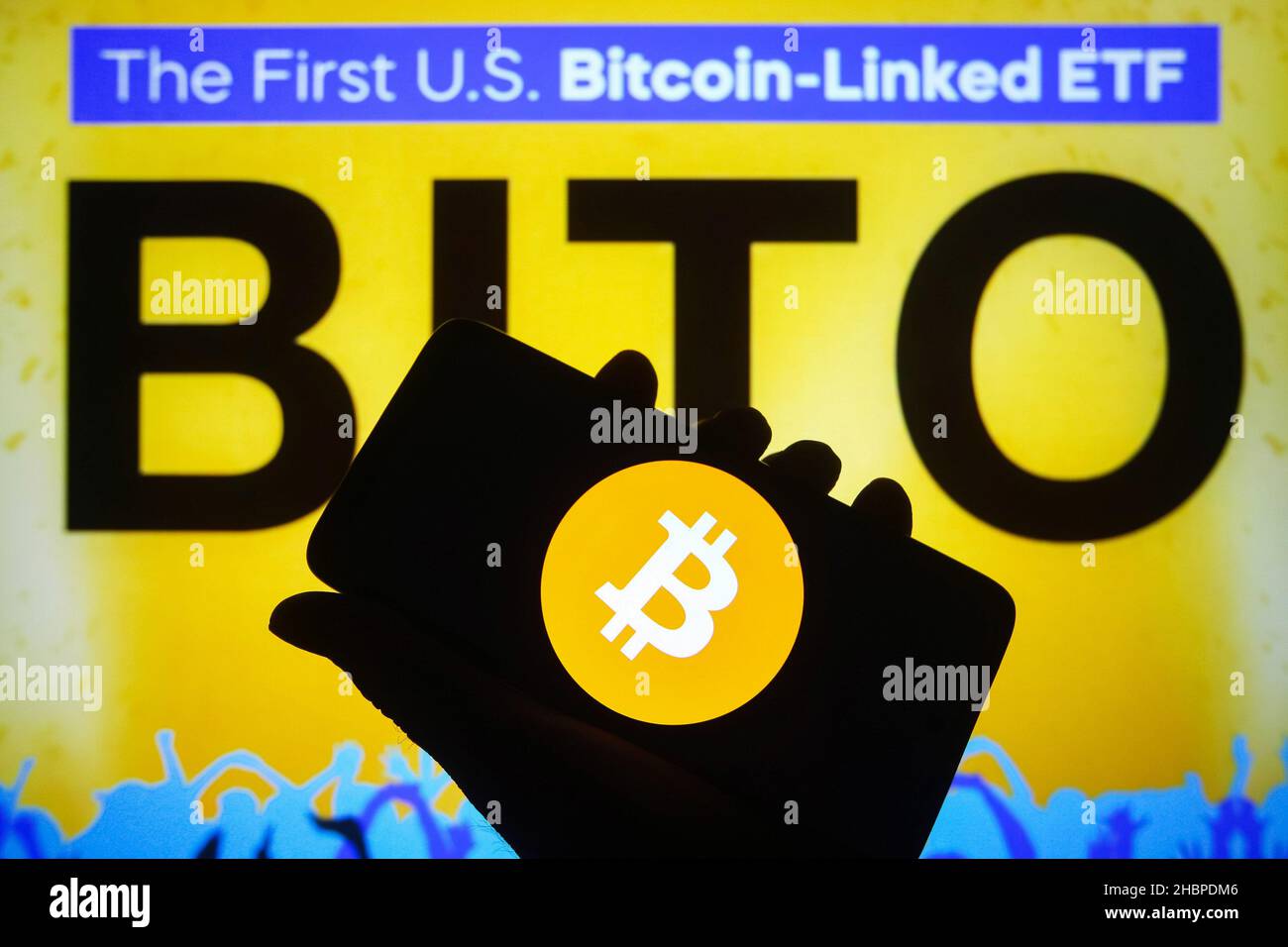 In this photo illustration, a ProShares Bitcoin Strategy ETF (BITO) logo of  the first U.S. bitcoin-linked ETF is seen on a smartphone screen and Bitcoin  cryptocurrency sign in the background. (Photo by