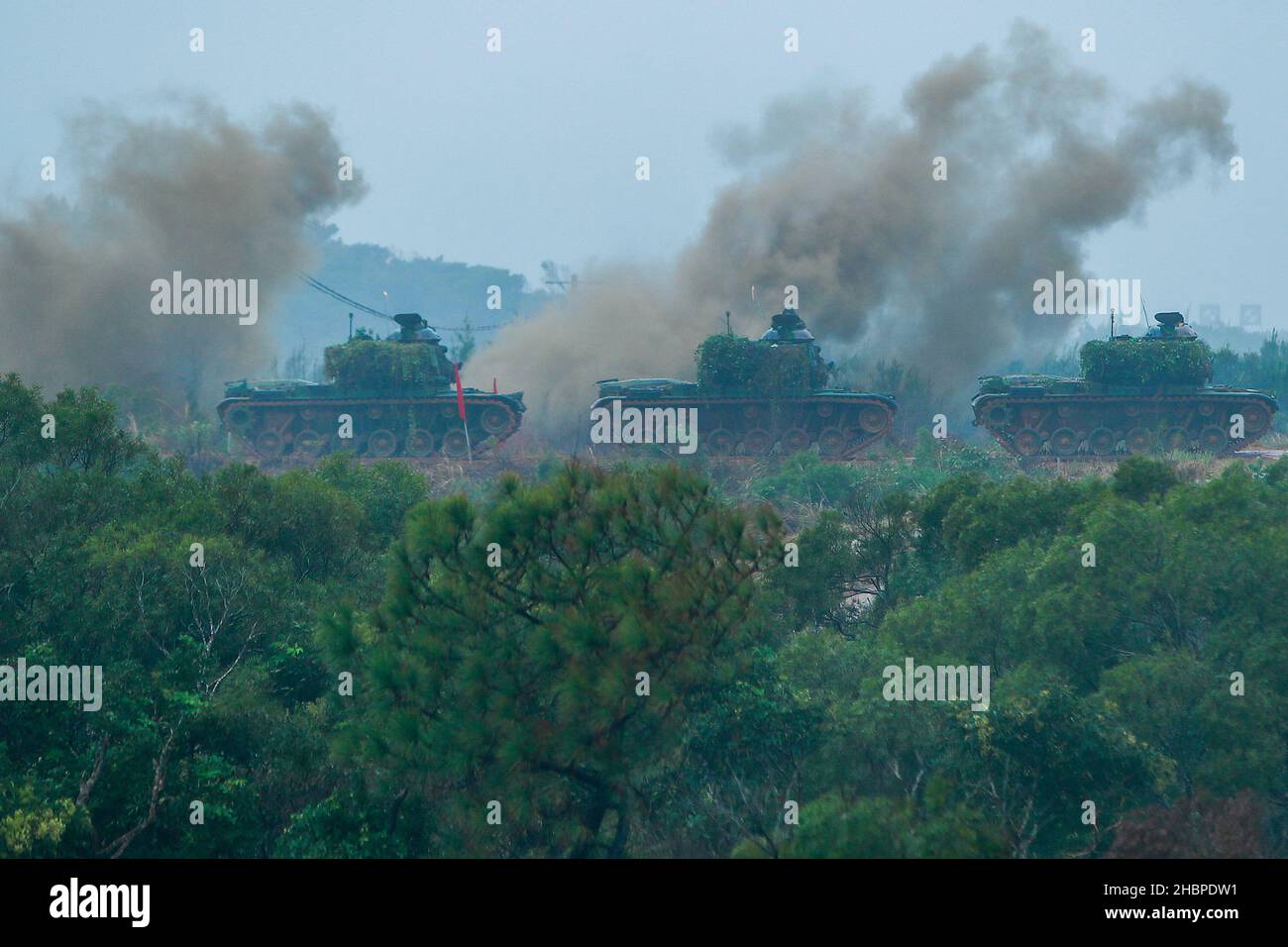 Hsinchu, Taipei, Taiwan. 21st Dec, 2021. M60-A3 tanks move to a spot during a live ammunition military drill at an undisclosed location, amid rising tensions with China. Taiwan has been facing intensifying military threats from China including Chinese PLA warplanes sent to cruise around the island, while the US has been offering more arm sales to Taiwan. (Credit Image: © Daniel Ceng Shou-Yi/ZUMA Press Wire) Stock Photo