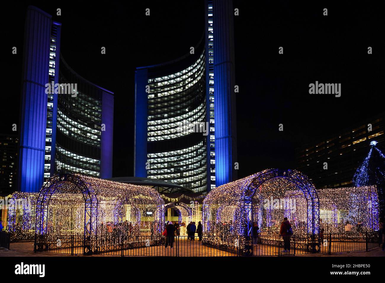 Toronto, Canada - December 20, 2021:  Toronto City Hall square is lit up with bright lights every year for the Christmas season. Stock Photo