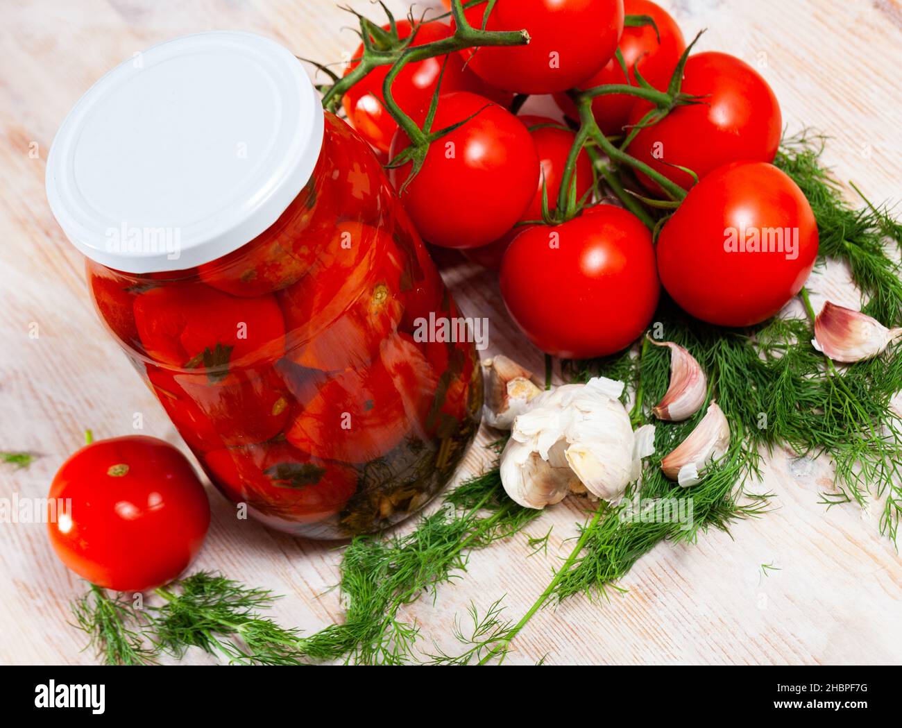 Pickled tomatoes in glass jar Stock Photo Alamy