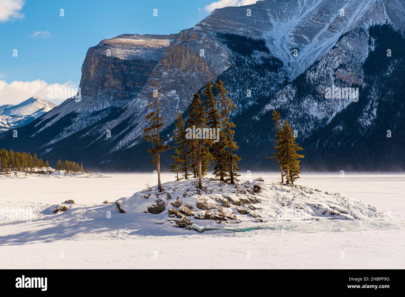 Beautiful winter views in Banff National Park Alberta Canada. Snowshoeing around a frozen lake. Stock Photo