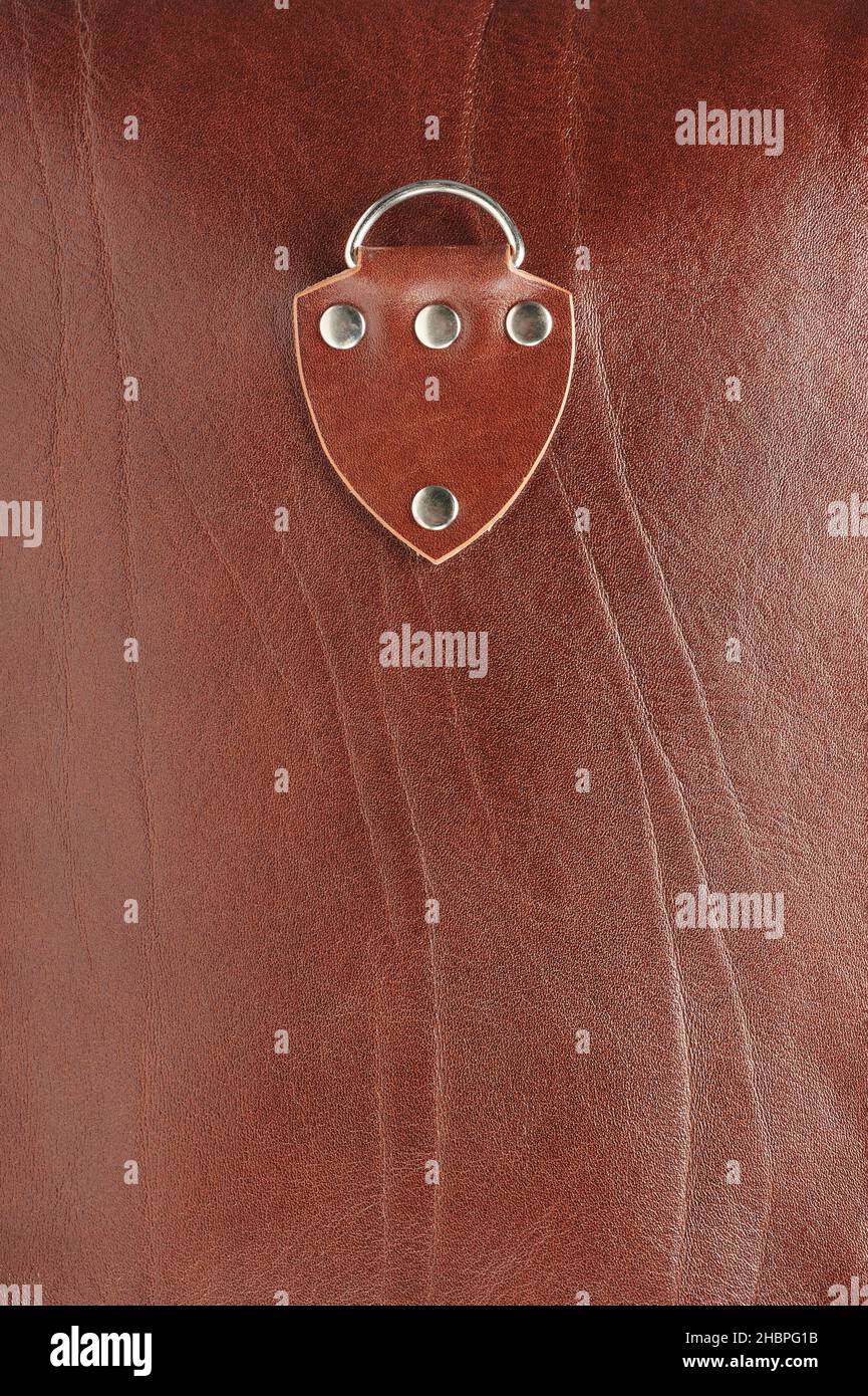 Brown leather sheet with  attachment patch macro close up view Stock Photo