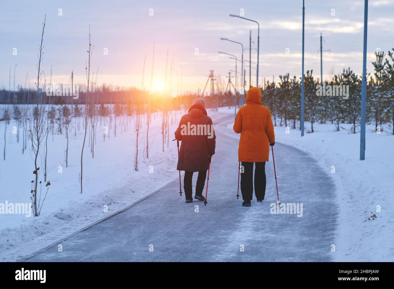 Two women walking on park hi-res stock photography and images - Alamy