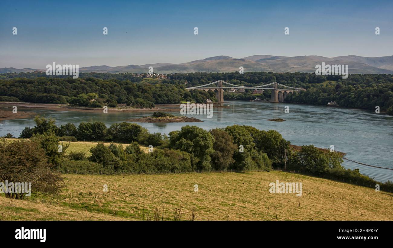 The menai suspension bridge is a suspension bridge to carry road traffic between the island of Anglesey and the mainland of Wales. Stock Photo