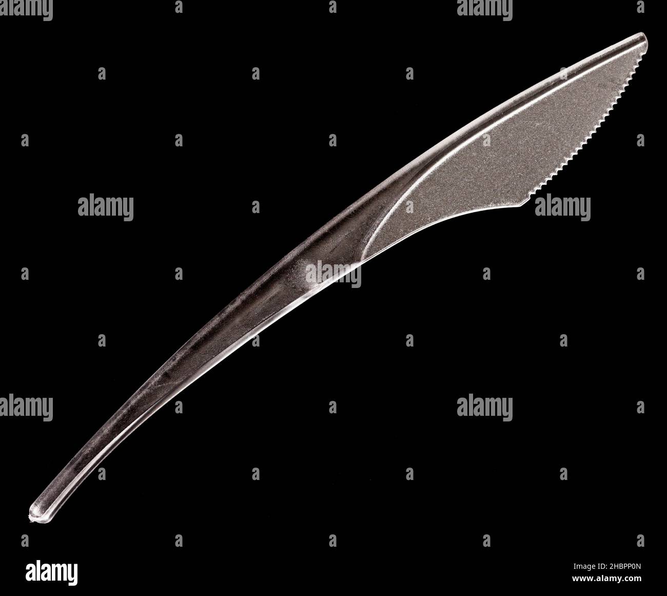 Plastic knife on black background Stock Photo