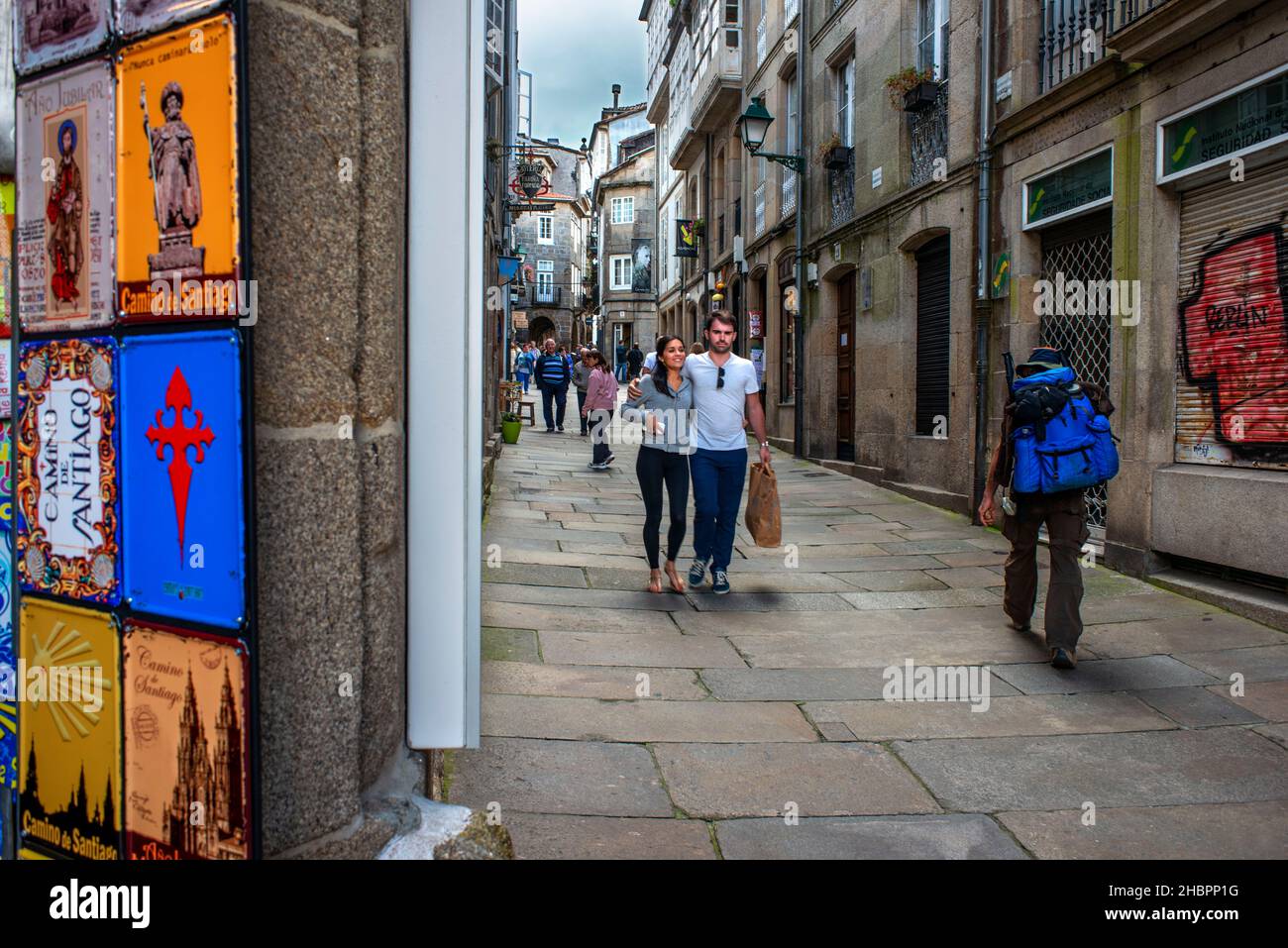 Daily life in typical narrow street Rua da Acibecheria in historic centre, Santiago de Compostela , Galicia , Spain Stock Photo