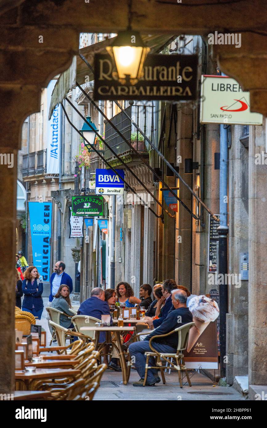Bars and restaurants in old Columns Medieval architecture in old town in Rúa do Vilar in the old Town, Santiago de Compostela, UNESCO World Heritage S Stock Photo