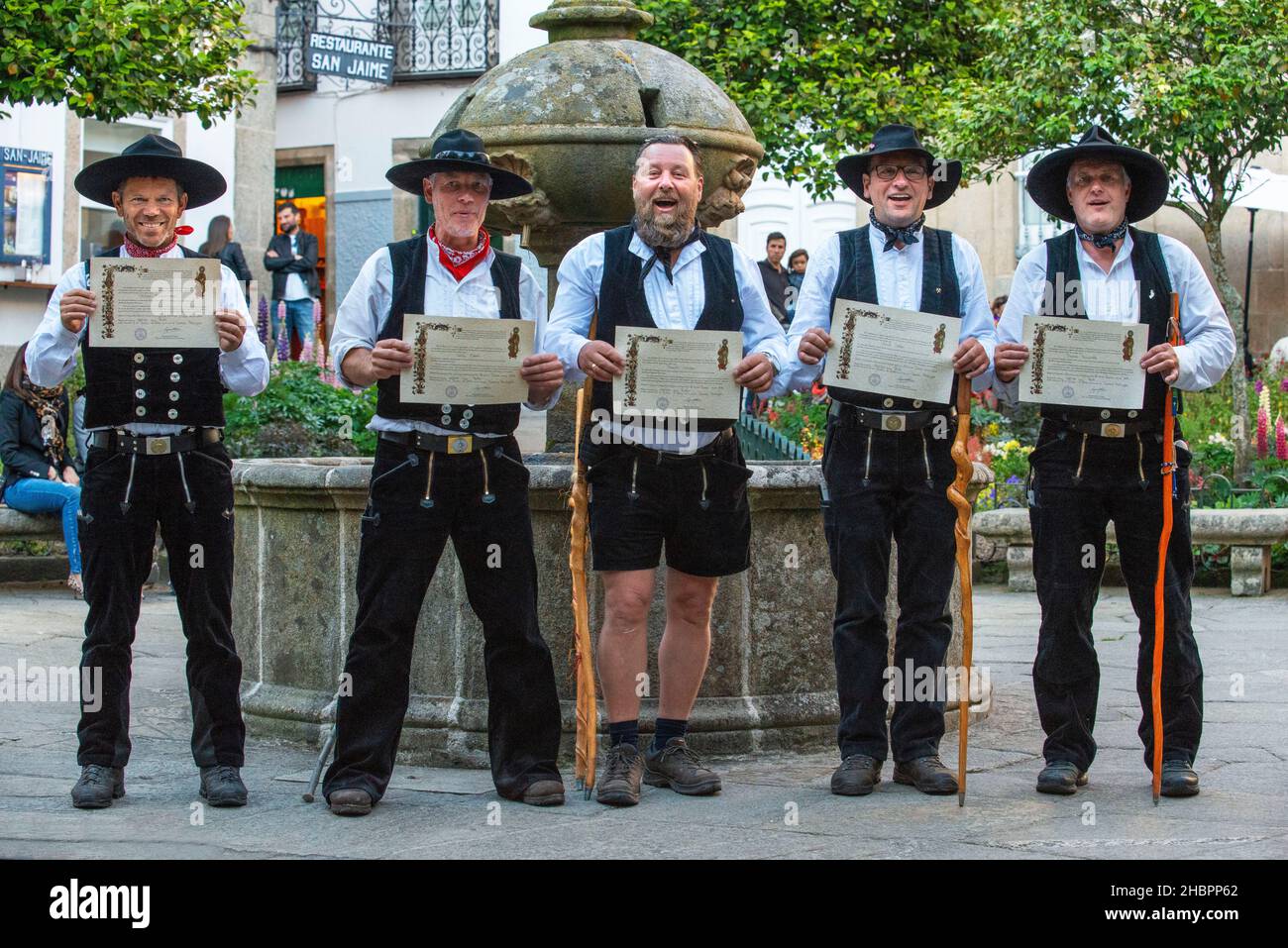 A group of pilgrims in the old Town, Santiago de Compostela, UNESCO World Heritage Site, Galicia, Spain. Stock Photo