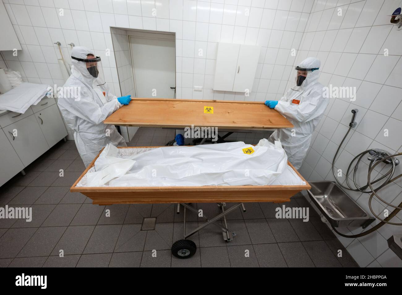 Ulm, Germany. 10th Dec, 2021. Two employees of the First Ulm Funeral