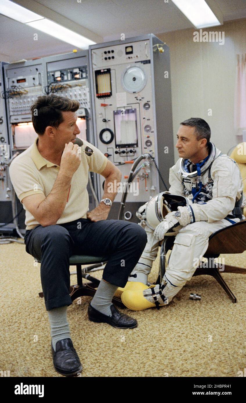 (23 March 1965) --- Astronaut Virgil I. Grissom (right), the command pilot of the Gemini-Titan 3 three-orbit mission, is shown with astronaut Walter M. Schirra Jr. in the ready room at Pad 16. The GT-3 was launched from Pad 19 the same day. Schirra was the command pilot of the backup crew. Stock Photo