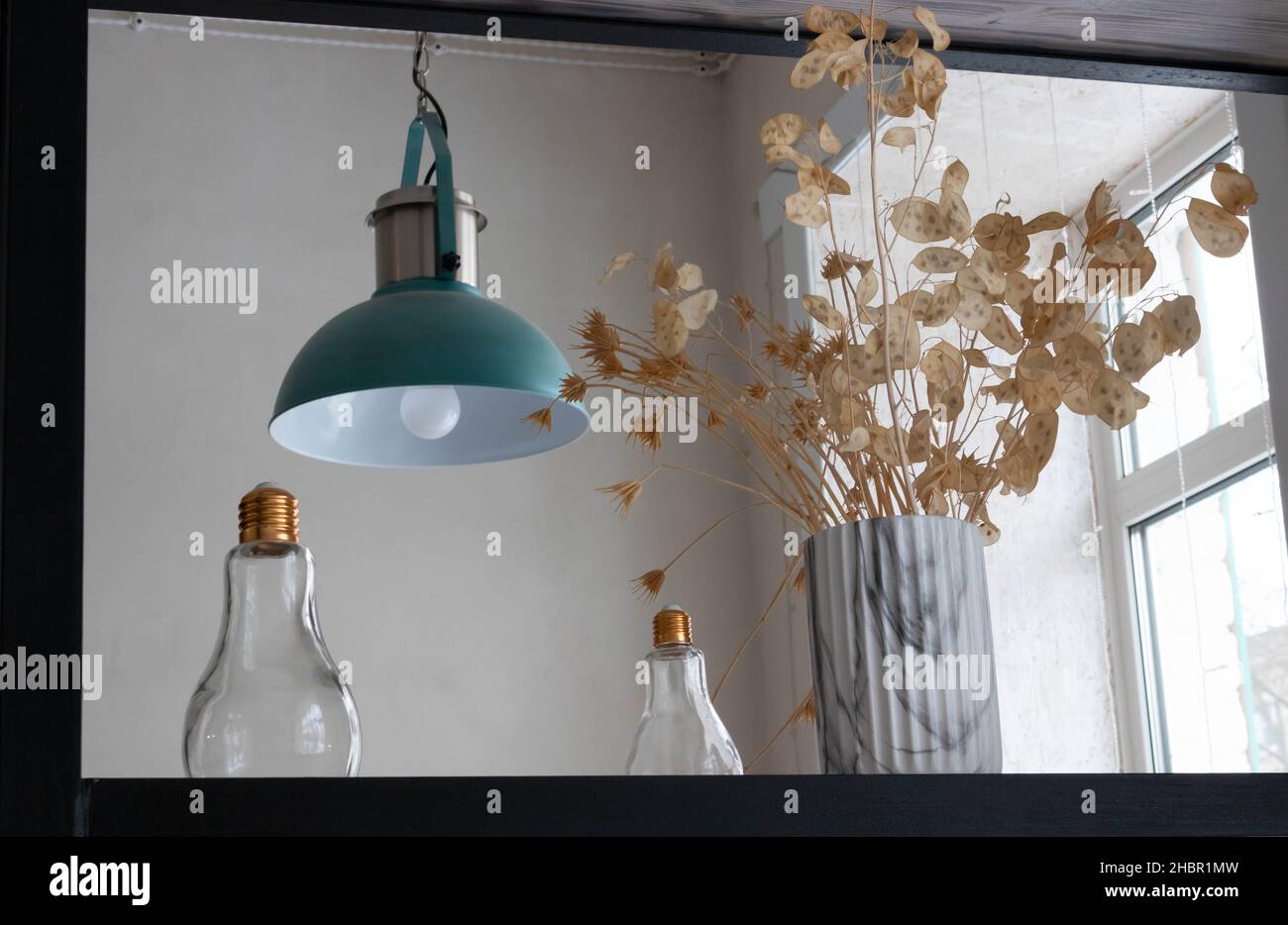 Ceiling blue pendant lamp. Decorative lamps on the shelf, home improvement technology. Stock Photo