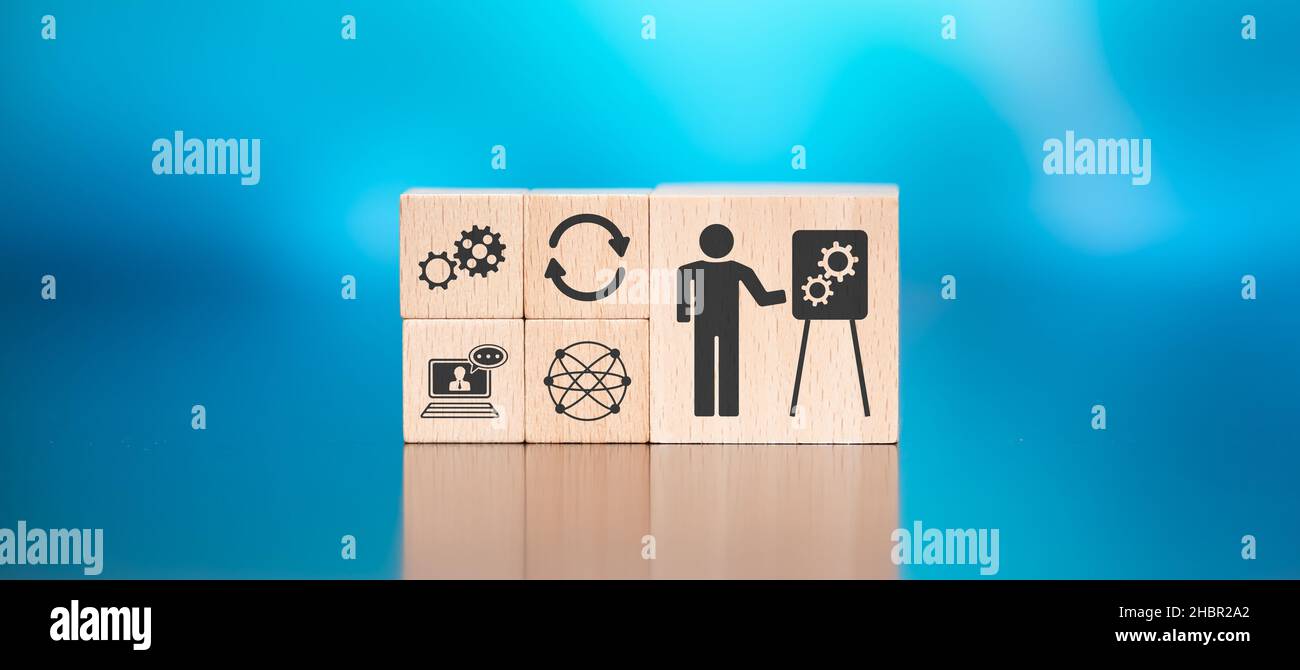 Wooden blocks with symbol of training concept on blue background Stock ...