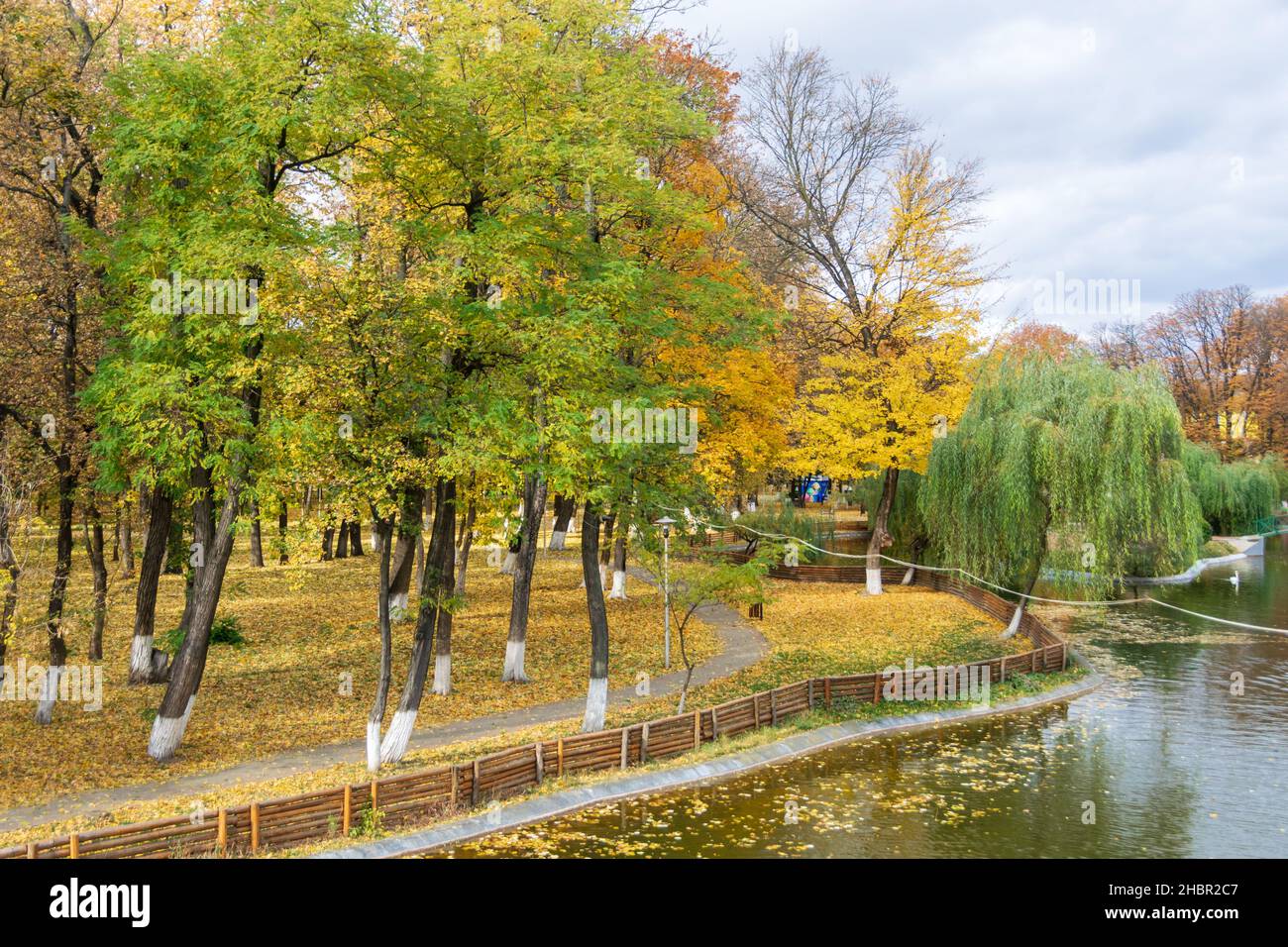 The lake from the Roman park in the autumn surrounded by colored trees, Romania Stock Photo