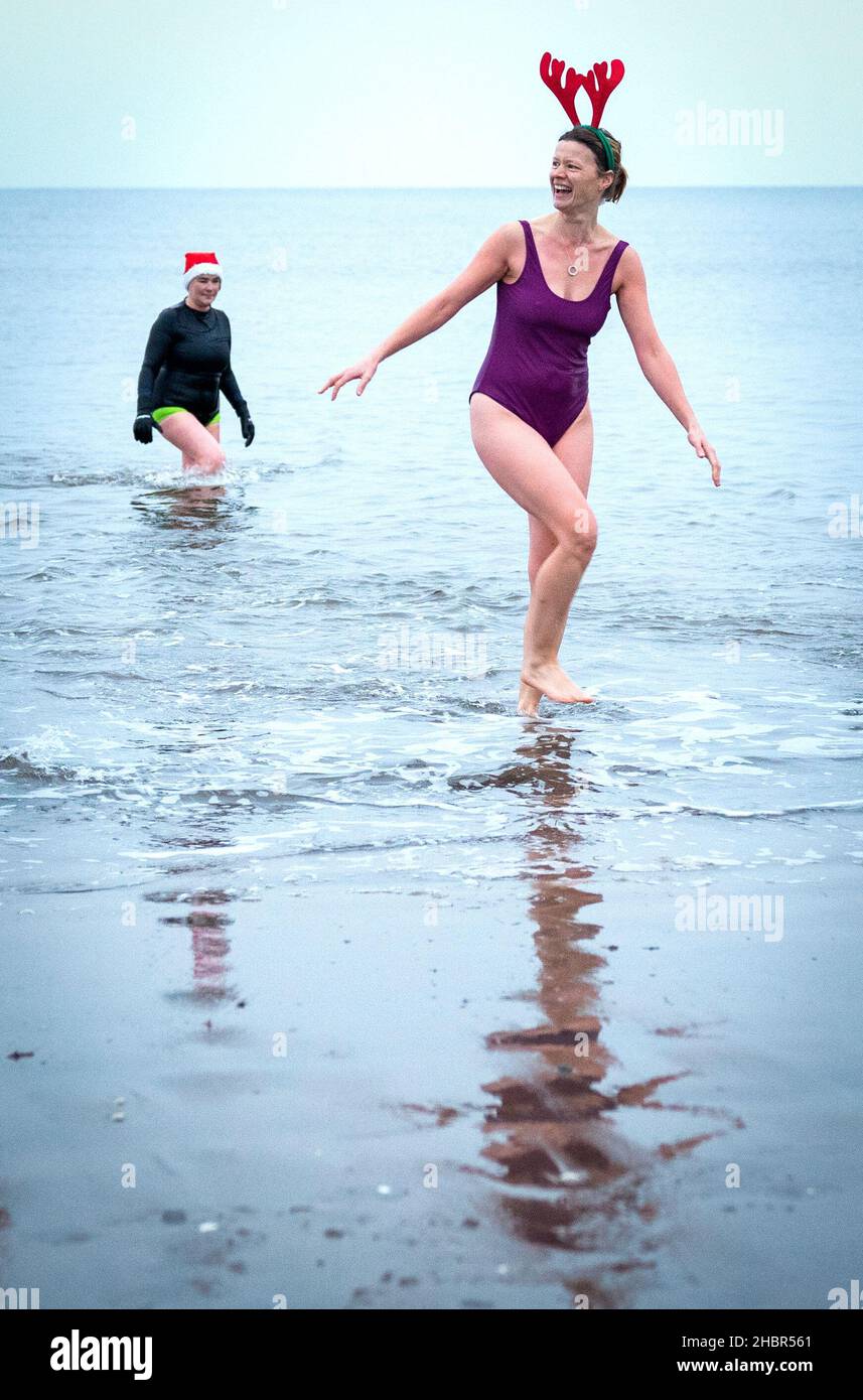 People take part in a winter solstice swim at Portobello Beach in Edinburgh to mark the solstice