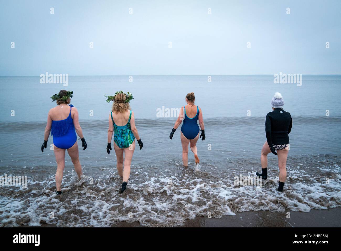 People take part in a winter solstice swim at Portobello Beach in Edinburgh to mark the solstice