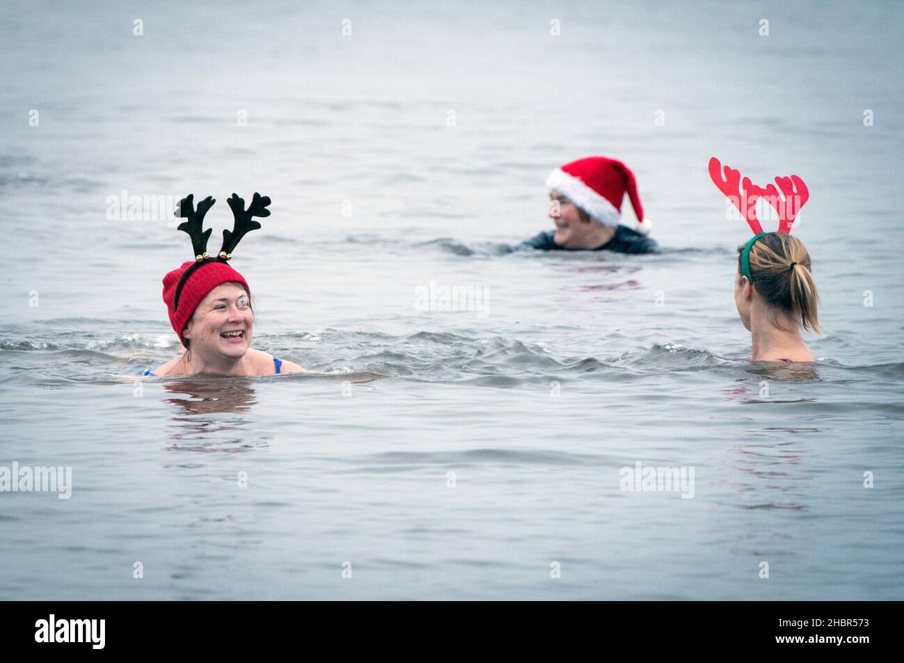 People take part in a winter solstice swim at Portobello Beach in ...