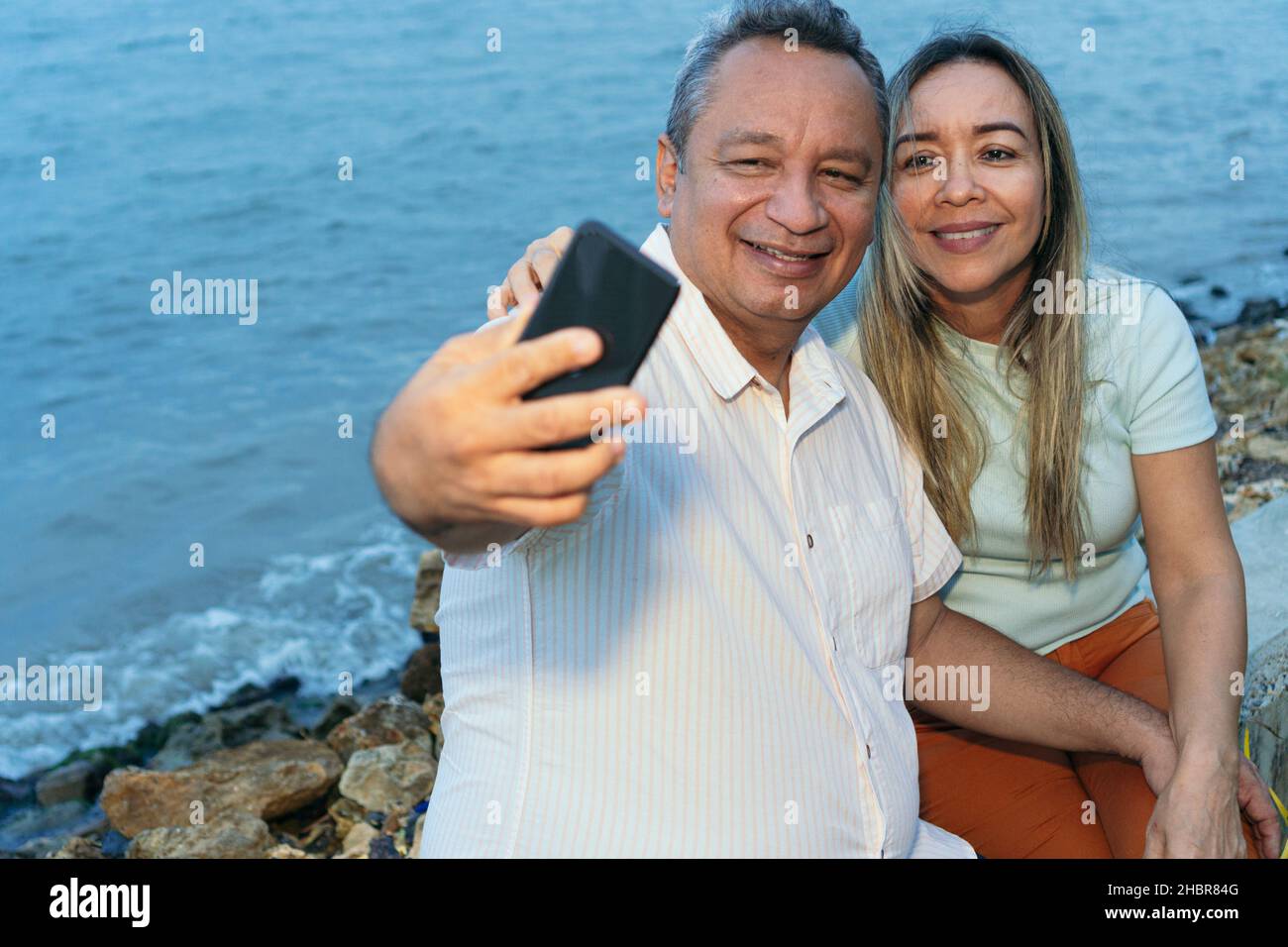 Older Couple Taking A Selfie With Their Mobile Stock Photo