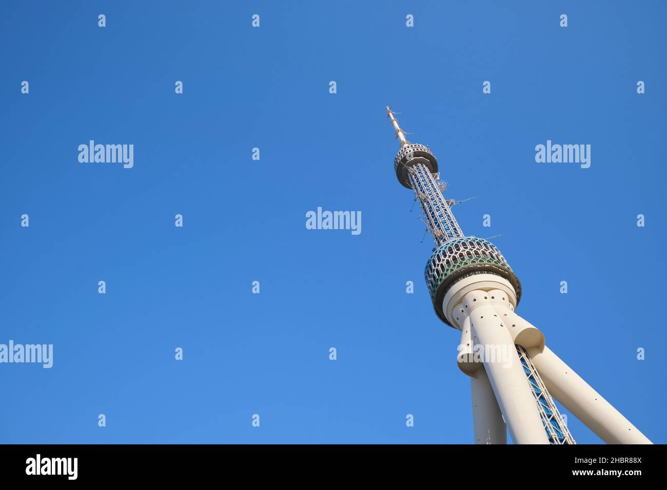 A horizontal view of the Tashkent Television Tower with blue sky ...
