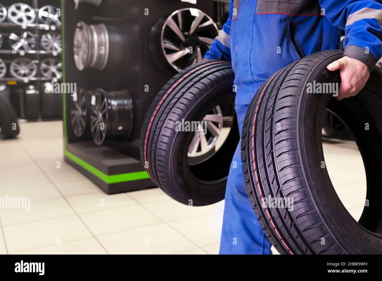 the buyer carries new tires to the exit of the tire shop, or the tire