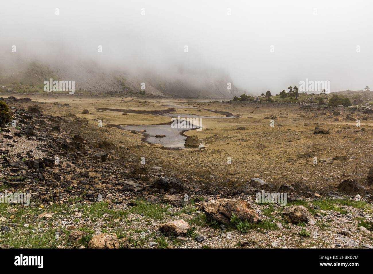 Misty Landscape Of Kulikalon Lakes In Fann Mountains Tajikistan Stock misty-landscape-of-kulikalon-lakes-in-fann-mountains-tajikistan-stock