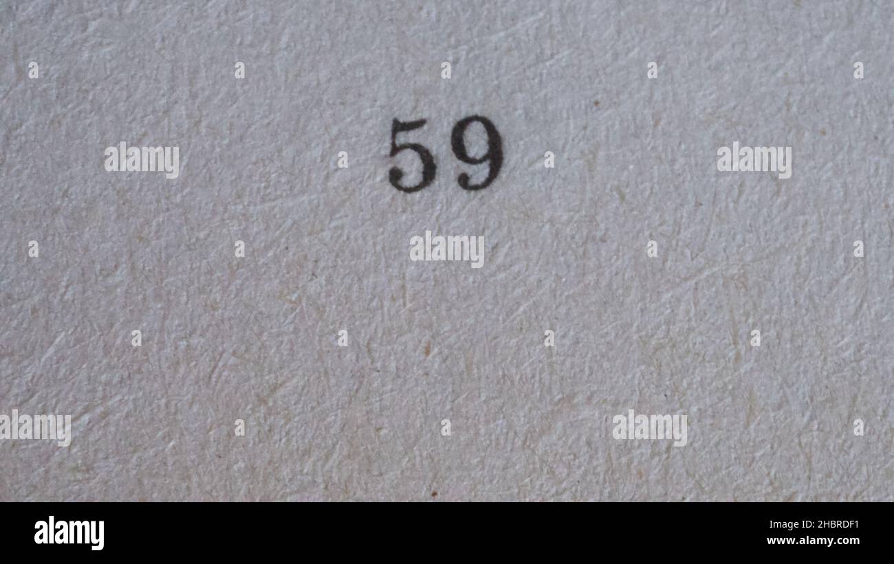 The number 59 printed on a piece of paper. Paper texture. Stock Photo