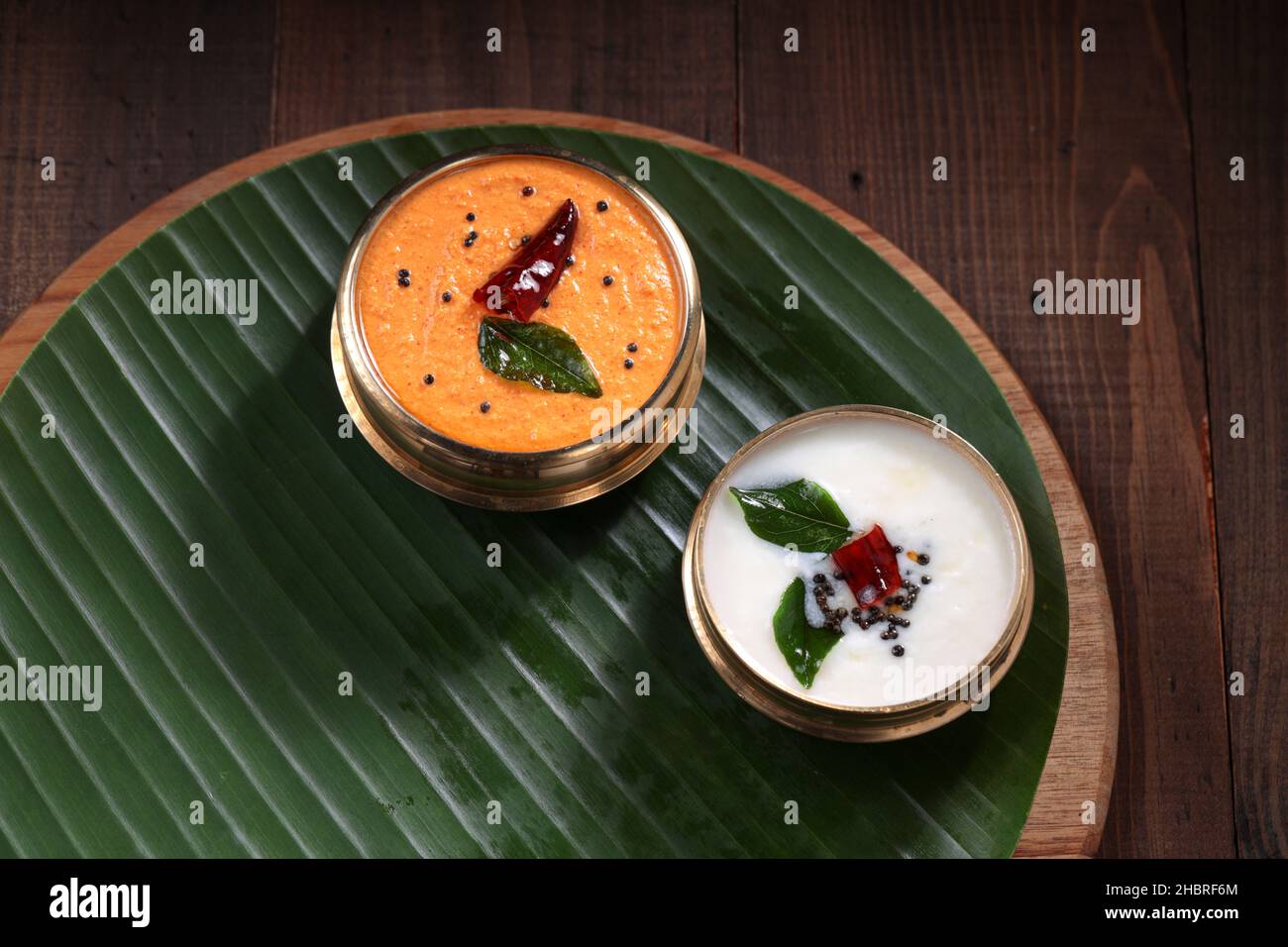 Coconut chutney ,south Indian main curry for breakfast items which is seasoned with mustard , dry chilly and curry leaves. Stock Photo