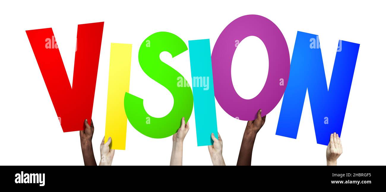Vision - human hands holding colorful letters Stock Photo - Alamy