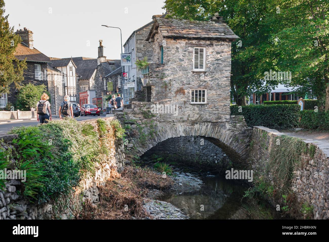 Ambleside Bridge House, view in summer of Bridge House, an historic bridge/summerhouse spanning Stock Ghyll, the town's small river, Cumbria, England Stock Photo