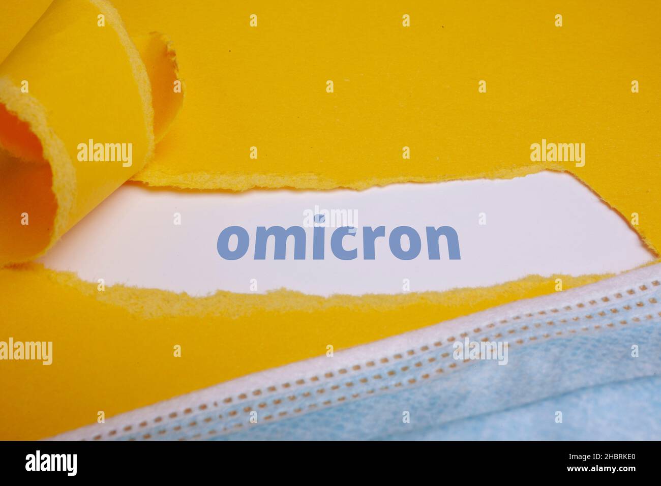 omicron torn Paper Concept Stock Photo