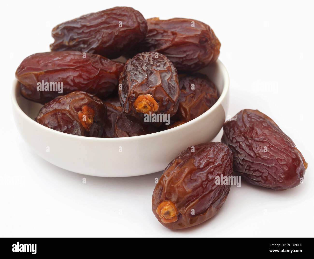 Fresh Arabian dates over white background Stock Photo - Alamy