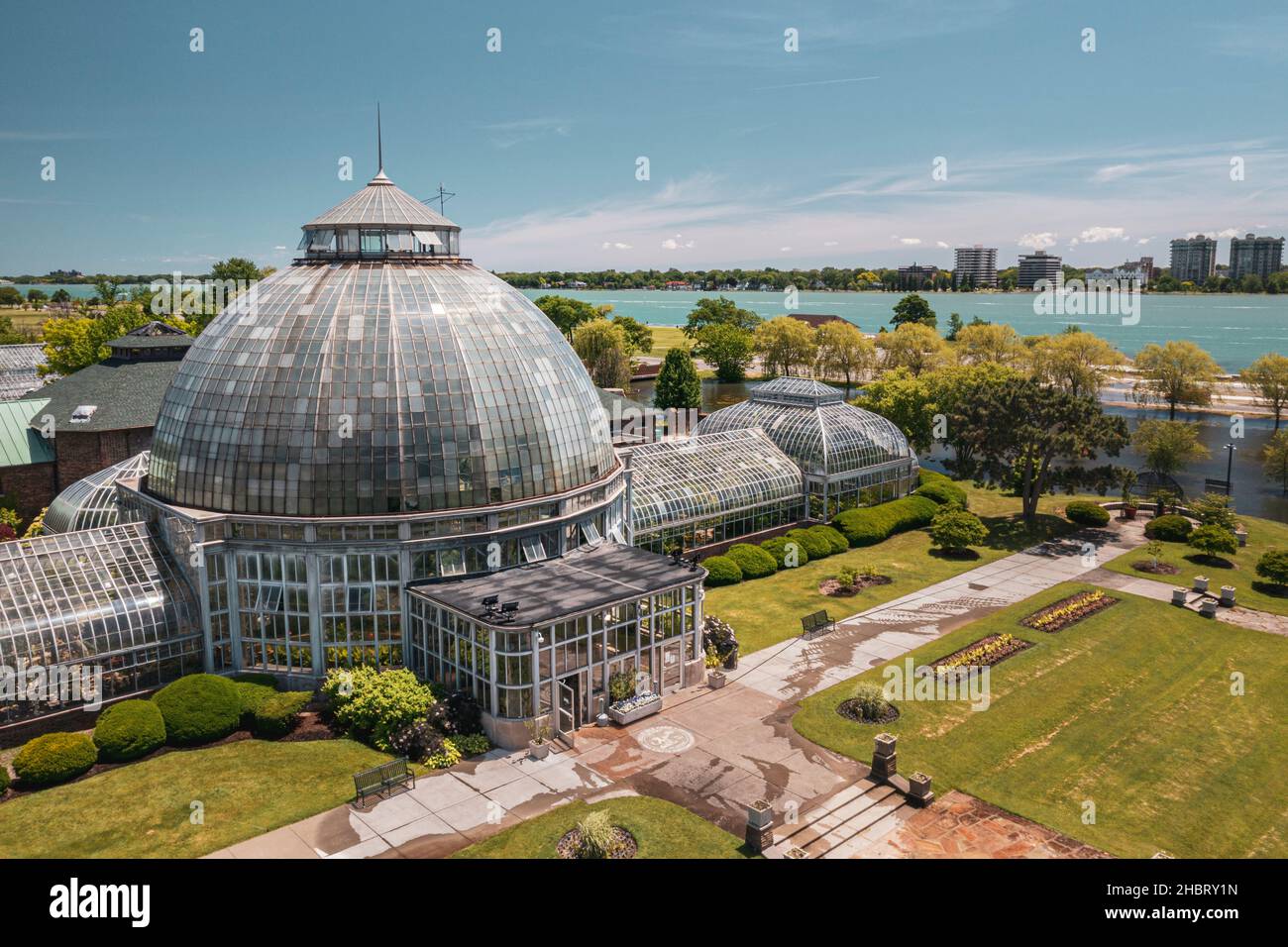 A low aerial view of Belle Isle Anna Scripps Whitcomb Conservatory and Detroit River, Detroit, Michigan Stock Photo