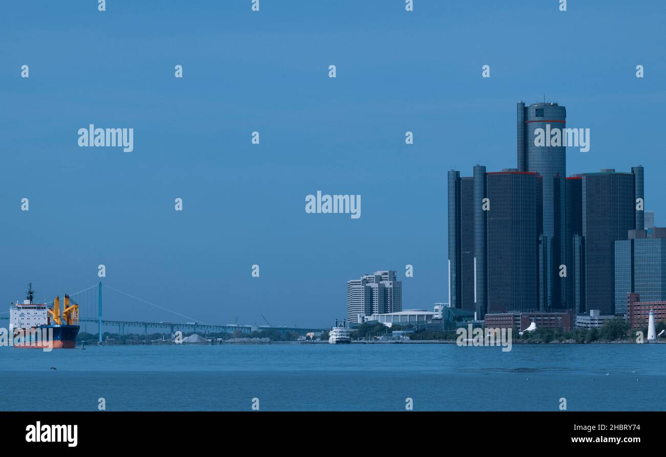 BBC Chartering Heavy Lift ship transits the Detroit River near the Ambassador Bridge, with downtown Detroit GM Renaissance Center Stock Photo