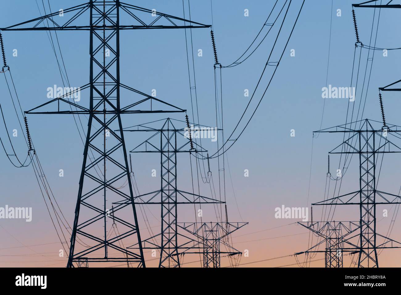 Overhead Electrical Pylons - transmission lines in Southeast Michigan USA operated by ITC Holdings Corp. provide Midwest grid capacity Stock Photo