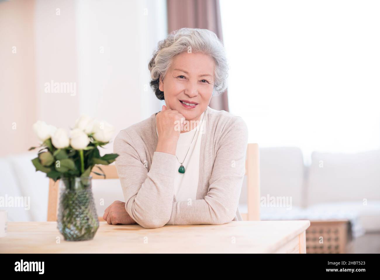 Woman thinking hand chin home hi-res stock photography and images - Alamy