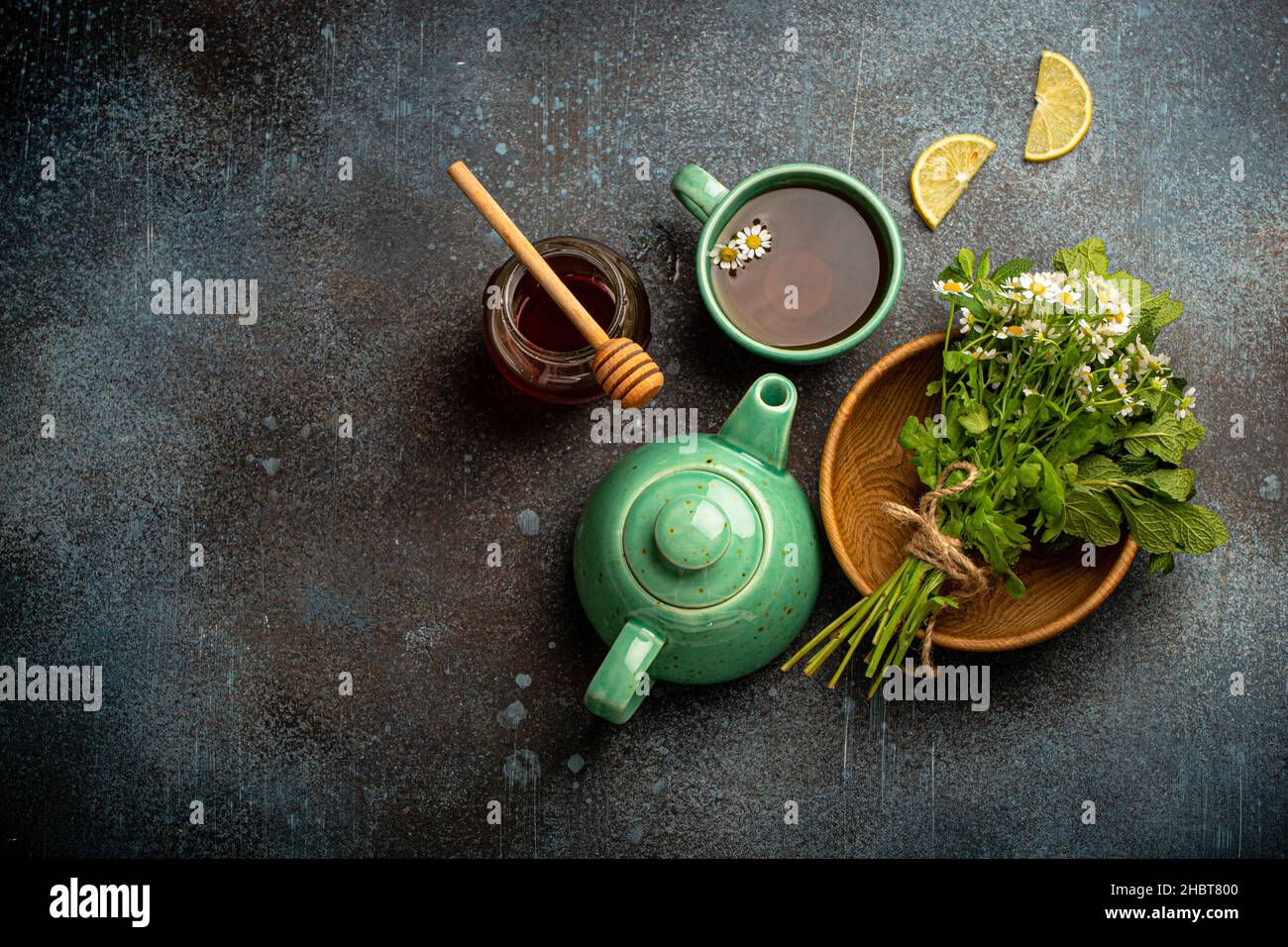 Herbal tea with natural healing medical herbs, tea cup, tea pot top