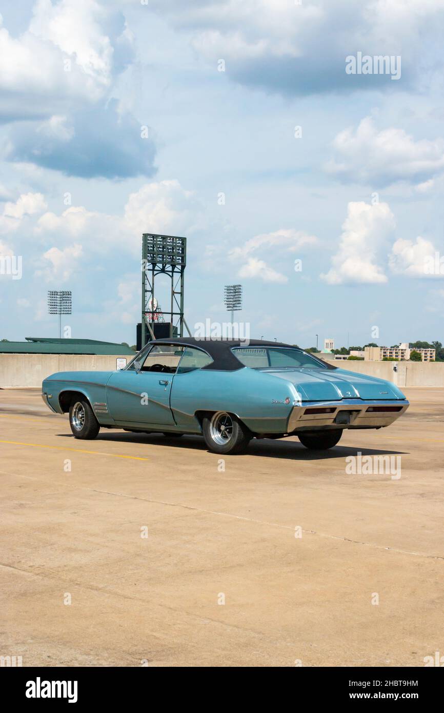 blue green vintage 1968 Buick Skylark coupe car parked on roof of multi storey car lot in Memphis Tennessee Stock Photo