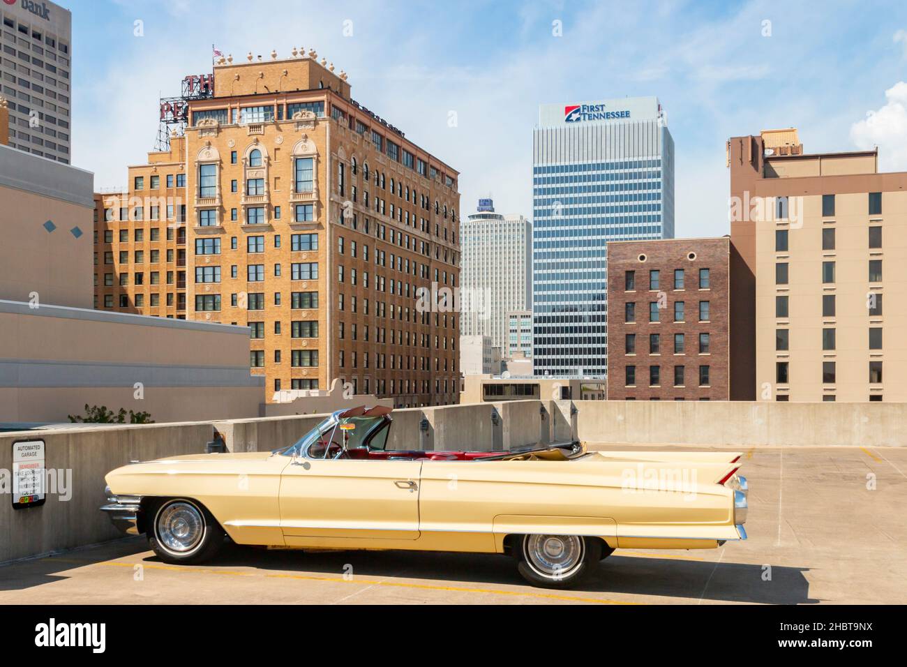 cream coloured 1962 vintage Cadillac coupe de ville parked on a car park roof Stock Photo