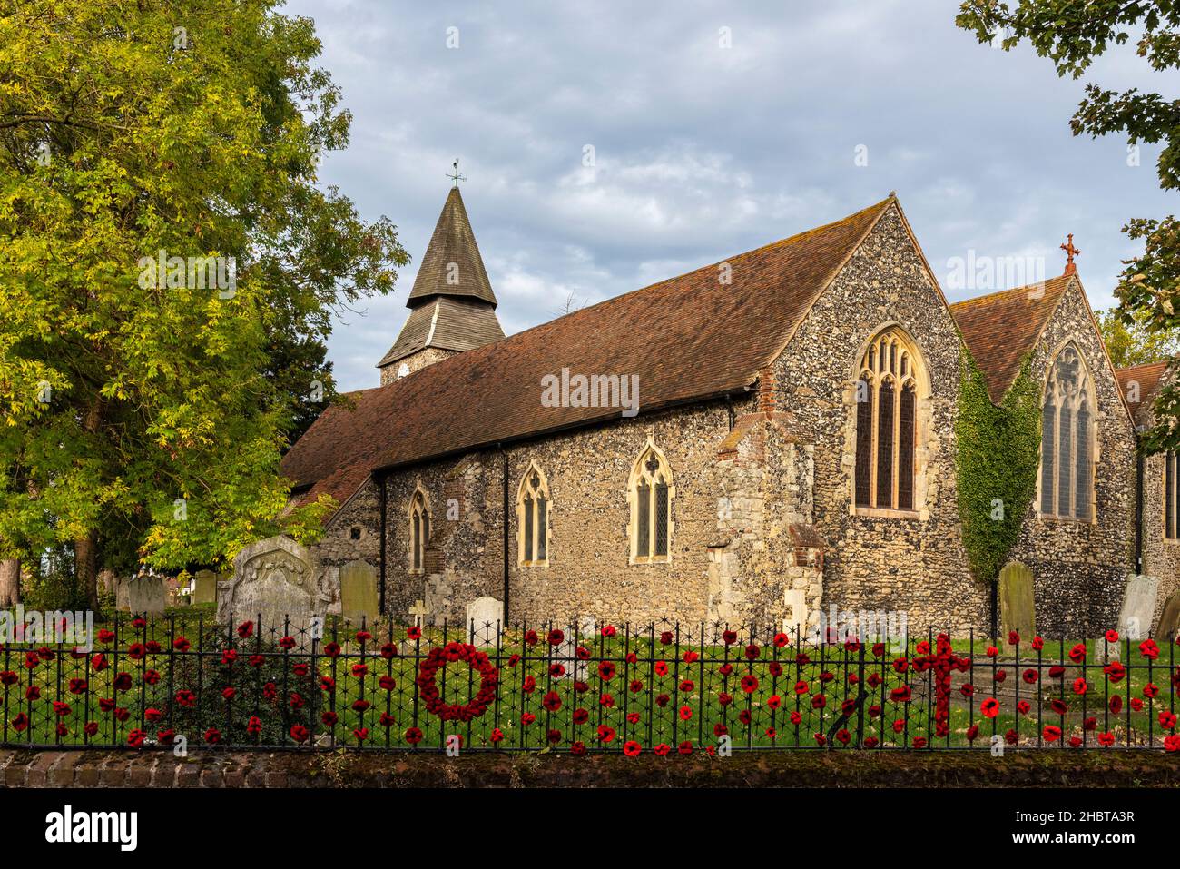 Church of Saint Mary the Virgin in Upchurch in Kent, England decorated with Poppies outside for Remembrance day. Stock Photo