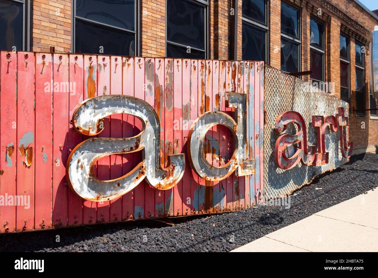 old ad art sign with red metal letters Stock Photo - Alamy