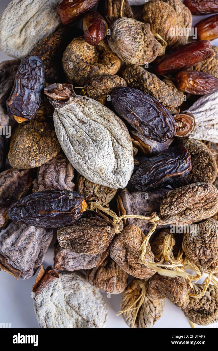 Dried dates and figs on the table. food background. Assortment of dried